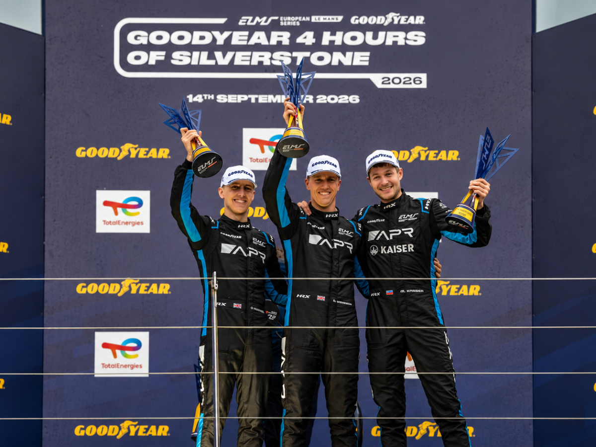 Algarve Pro Racing drivers Jake Hughes, Ben Barnicoat and Matthias Kaiser raise their trophies after winning the 2026 Goodyear 4 Hours of Silverstone.