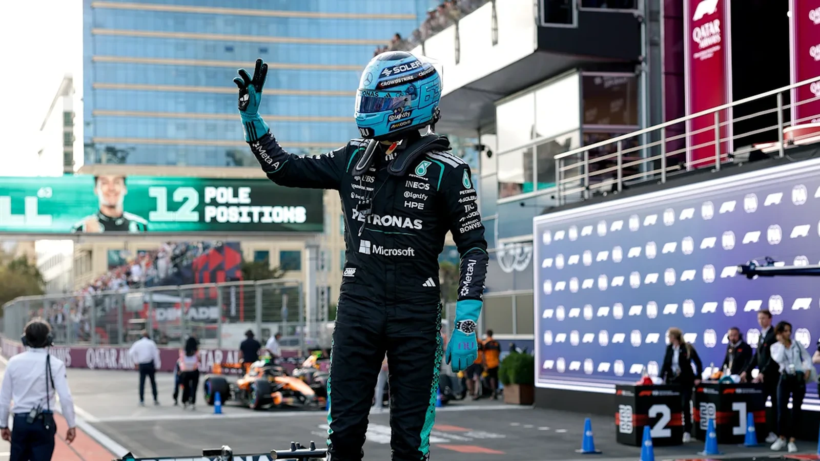 George Russell celebrates after claiming pole position for the 2026 Azerbaijan Grand Prix in Baku.