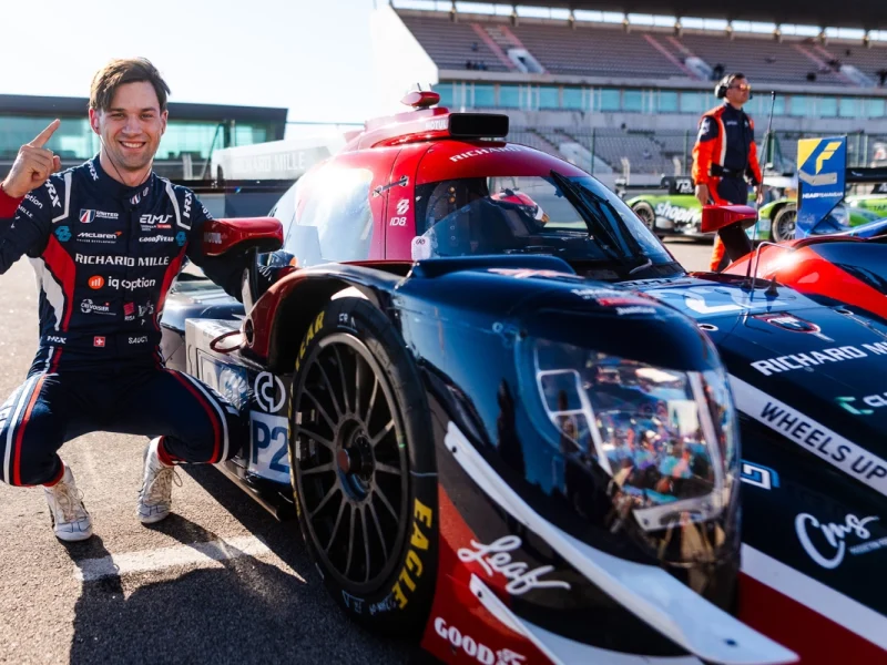 Grégoire Saucy celebrates beside the No. 22 United Autosports Oreca after securing LMP2 pole position for the 2026 4 Hours of Portimão.