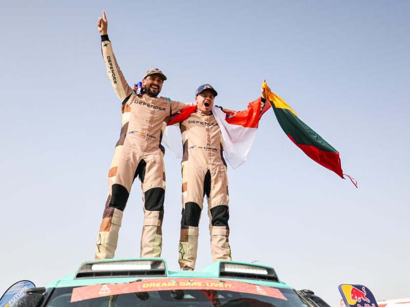 Rokas Baciuška and Oriol Vidal celebrate after securing the 2026 FIA World Rally-Raid Championship Stock titles with Defender Rally.