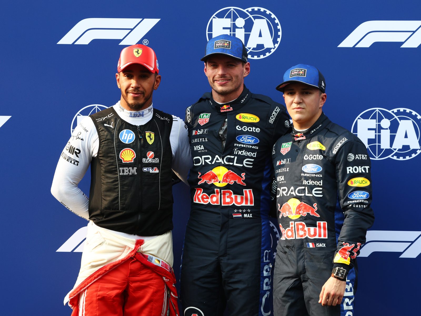 Lewis Hamilton, Max Verstappen and Isack Hadjar pose together after qualifying at the Sepang International Circuit for the 2026 Bahrain Grand Prix in Malaysia.